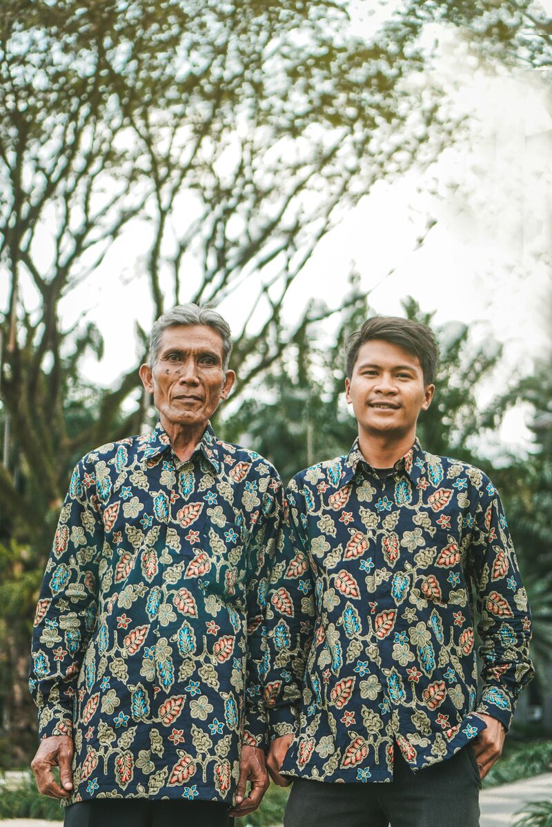 Two men standing outdoor during daytime